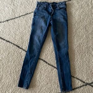 These jeans are the brand named blue spice with ruffles around the waist